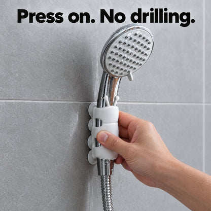 Pressing the suction holder onto smooth tile, no drilling